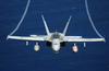 An F/a-18 Hornet Assigned To The Mighty Shrikes Of Strike Fighter Squadron Ninety Four (vfa-94), Flies Over The Western Pacific Ocean During Flight Operations Aboard Uss Nimitz (cvn 68) Image