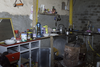 A Modest Array Of Items Sits Inside The Makeshift Kitchen Where Saddam Hussein Probably Ate His Last Meal Before His Capture. Image