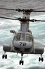 A Ch-46 Sea Knight Transfers Supplies From Fast Combat Support Ship Uss Bridge (aoe 10) To Uss Nimitz (cvn 68) During A Connected Replenishment (conrep) Image