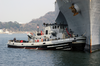 A Large Harbor Tug Uss Opelika (ytb 798) Assists Amphibious Command And Control Ship Uss Blue Ridge (lcc 19) To Its Berth After A Scheduled Deployment In The Western Pacific Image