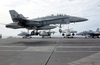 An F/a-18  Hornet  Assigned To The  Rough Raiders  Of Strike Fighter Squadron One Two Five (vfa-125) Keeps Its Tailhook Up During Carrier Flight Deck Training Exercises. Image