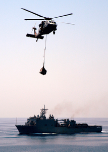 A Mh-60s Knighthawk Assigned To The  Chargers  Of Helicopter Combat Support Squadron Six (hc-6) Delivers One Of Many Palettes Of Supplies To The Amphibious Assault Ship Uss Wasp (lhd 1). Image