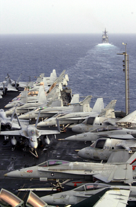 Various Navy Aircraft Are Chocked And Chained To The Flight Deck, As The Guided Missile Cruiser Uss Princeton (cg-59) Steams Forward Of Uss Nimitz (cvn 68) Image