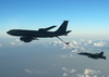 An F/a-18 Hornet Assigned To The Marauders Of Strike Fighter Squadron Eight Two (vfa-82) Refuels With An U.s. Air Force Kc- 135r Fuel Tanker. Image