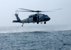 Search And Rescue Swimmers Assigned To The Chargers Of Helicopter Combat Support Squadron Six (hc-6) Stand Ready Aboard An Mh-60s Knighthawk Image