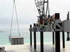 U.s. Navy Seabees Assigned To Amphibious Construction Battalions (acb) One And Two Lift The Next Roadway Section To Be Used In The Building Of The Elevated Causeway System-modular (elcas (m)) Structure At Camp Patriot Image