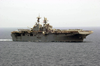 The Amphibious Assault Ship Uss Iwo Jima (lhd 7) Cruises Alongside Uss Nimitz (cvn 68) Image