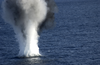 A Dummy Mine Explodes After Service Members Assigned To Explosive Ordnance Disposal Mobile Unit Six (eodmu-6) Attached 20 Pounds Of Explosives To The Device During A Mine Counter Measures Exercise. Image