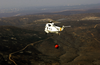 An Uh-3h Sea King Helicopter Assigned To The Golden Gaters Of Helicopter Combat Support Squadron Eight Five (hc-85) Strapped With A Bambi Bucket Full Of Water Participates In A Training And Certification Flight Image