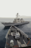 The Guided Missile Destroyer Uss John S. Mccain (ddg 56) Closes In On The Bow Of The Guided Missile Cruiser Uss Vincennes (cg 49), Commencing A Towing Exercise. Clip Art