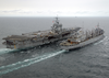 The Fast Combat Support Ship, Uss Detroit (aoe-4) Steams Alongside Uss Enterprise (cvn 65) While Conducting An Early Morning Replenishment At Sea (ras) Image