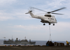 Sa-332 Super Puma Helicopters From Military Sealift Command Combat Stores Ship Usns Spica (t-afs 9) Delivers Pallets Of Supplies To Uss Kearsarge (lhd 3) Image