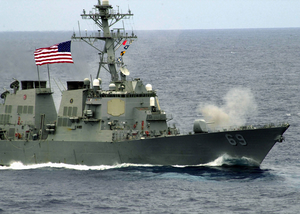 The Arleigh Burke-class Destroyer Uss Milius (ddg 69) Fires Its 54-caliber (mk 45) Lightweight Gun. Image