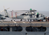 Airmen From Usns Niagara Falls (t-afs-3) Are Seen Conducting Maintenance On Top Of An Sh-60s Seahawk During A Recent Underway Replenishment With Uss Blue Ridge (lcc 19). Image