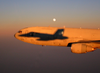 An F/a-18c Hornet Assigned To The Marauders Of Strike Fighter Squadron Eight Six (vfa-82) Casts Its Shadow Onto A U.s. Air Force Kc-10a Extender. Image