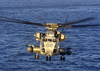 A Ch-53e Flies Over The Atlantic Ocean At Sunrise During Deck Landing Qualification Image